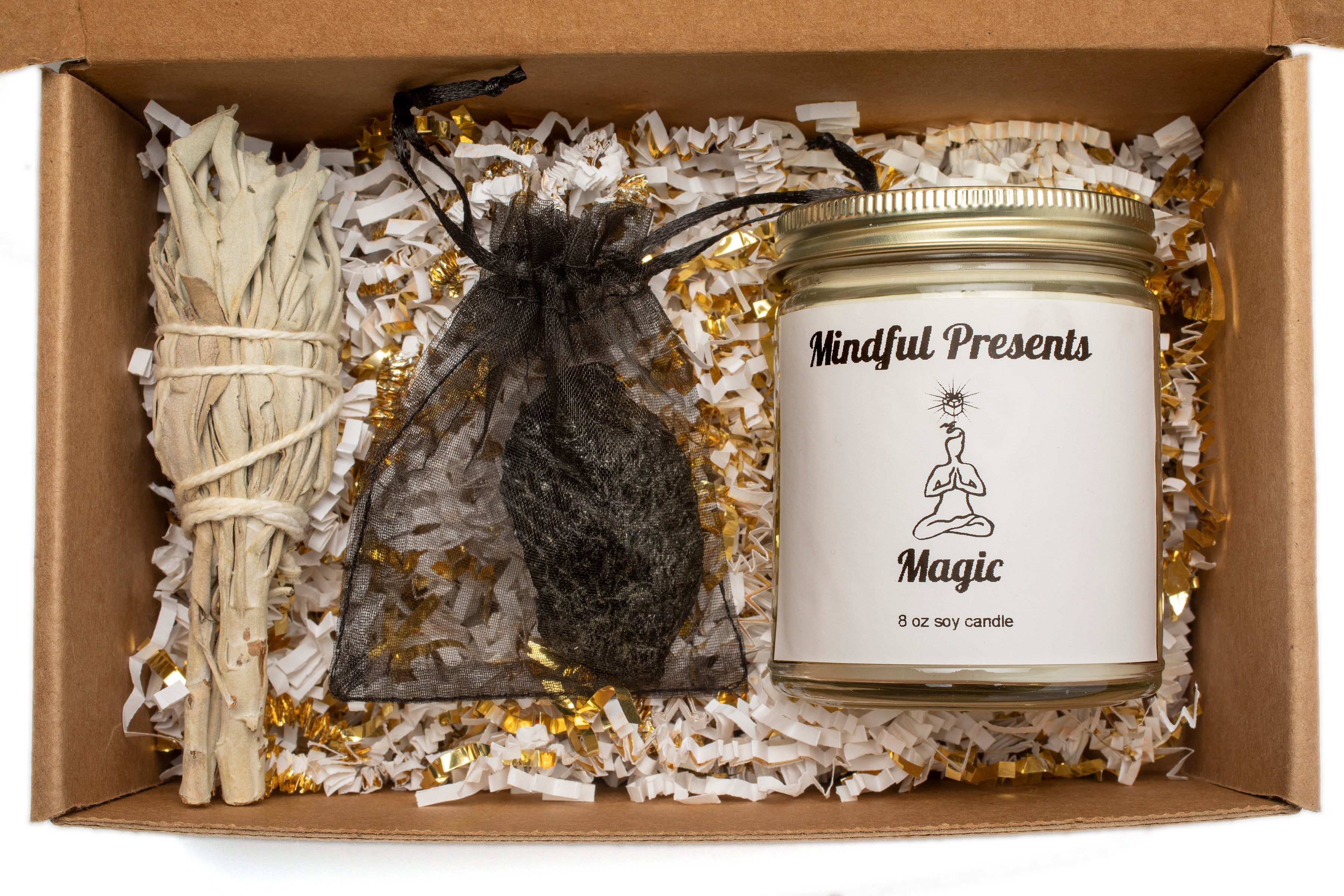 Our Magic Box comes with a Mindful Presents Magic candle, sage, and a black tourmaline crystal. 